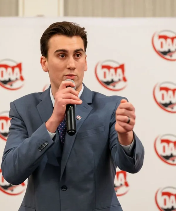 Man speaking with microphone at event